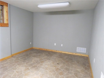 65,936 sq ft Facility with Large Parking Area and Garage - image 8