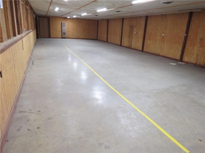 65,936 sq ft Facility with Large Parking Area and Garage - image 11