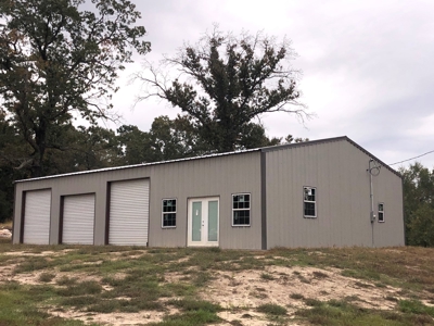 Outstanding Commercial Lot with New Shop on HWY 59 S - image 1