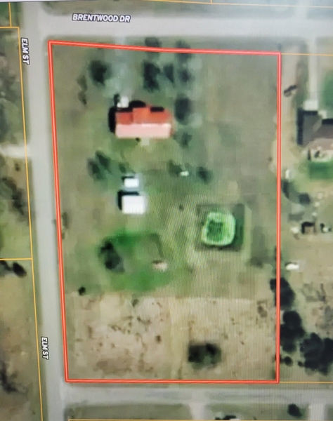 Arial of 3 Acres with home and 3 outbuildings