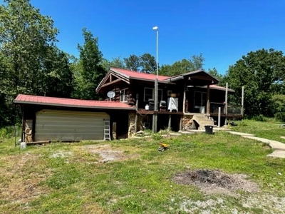 Log Cabin and 49 +/- Acres in Alton Missouri - image 2