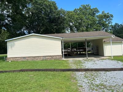 Very nice mobile home on 1 acre with carport and storage - image 2