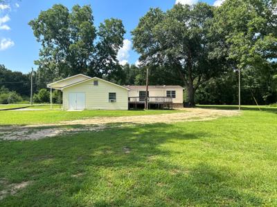 Very nice mobile home on 1 acre with carport and storage - image 4