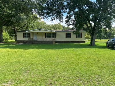 Very nice mobile home on 1 acre with carport and storage - image 1