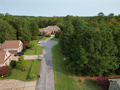 Beautiful, over half acre lot in desirable gated community - image 3
