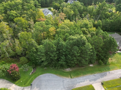 Beautiful, over half acre lot in desirable gated community - image 1