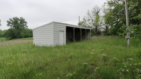 75 Acres m/l with Buildings/ Lake/ Income - image 20