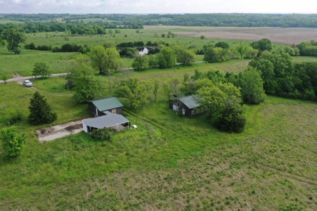 75 Acres m/l with Buildings/ Lake/ Income - image 8