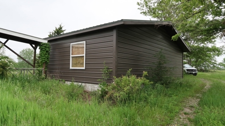 75 Acres m/l with Buildings/ Lake/ Income - image 31