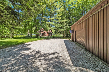 Quintessential Michigan lake cottage with acreage - image 27