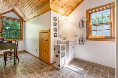 Quintessential Michigan lake cottage with acreage - image 9