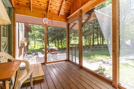 Quintessential Michigan lake cottage with acreage - image 15