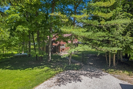 Quintessential Michigan lake cottage with acreage - image 31