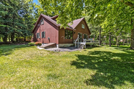 Quintessential Michigan lake cottage with acreage - image 30