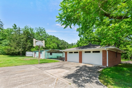 Home on stocked lake and fishing pier with 143 acres - image 28