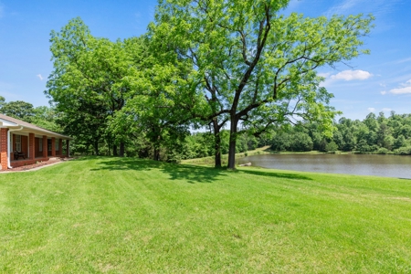 Home on stocked lake and fishing pier with 143 acres - image 19
