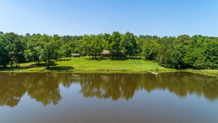 Home on stocked lake and fishing pier with 143 acres - image 1
