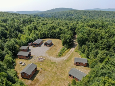 140 Acres, 6 Cabins, Pond, Brooks, and Outdoor Adventures - image 1