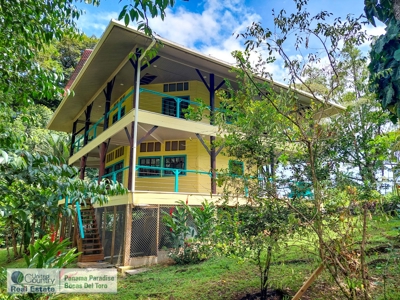 Titled Waterfront Home with Elevated Views and Sea Breezes - image 1