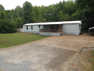 1997 Clayton Mobile Home on .48 Acre with a Stream! - image 1