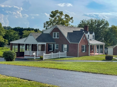 Renewed Brick Cape Cod With Acreage For Sale In Galax VA - image 1
