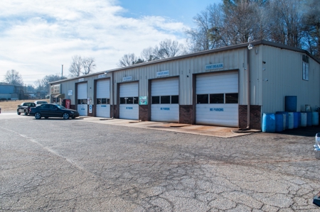 For Sale: Income-Producing Garage/Warehouse on 1.12+/- Acres - image 1
