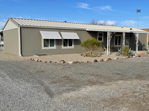 This well cared for home is located on Colorado Way, a quiet, paved street at the edge of the Indian Hills community. It's easy to get to know your neighbors here, and an active community center is a short walk away.