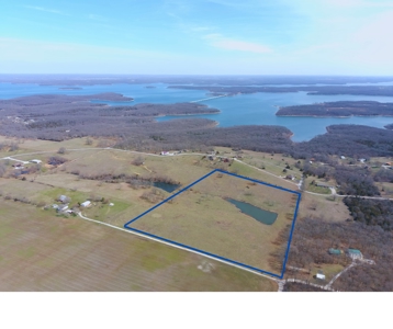 20 acres near Stockton Lake with a stocked pond! - image 4