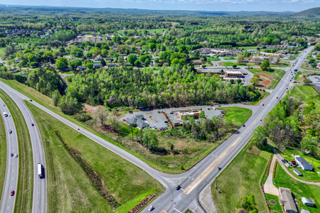 19.75 Acres of Commercial Land and Buildings - image 8