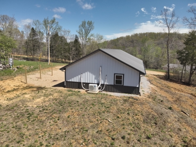 Charming Country Barndominium with Spacious Shop Near Linden, TN - image 2