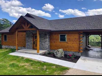Large Custom Log Home Overlooking The Ozarks For Sale - image 1