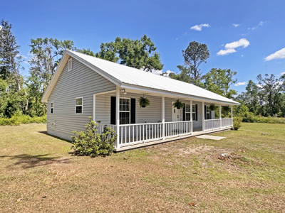 Lake Home with Attached Garage For Sale in Jennings, FL - image 41