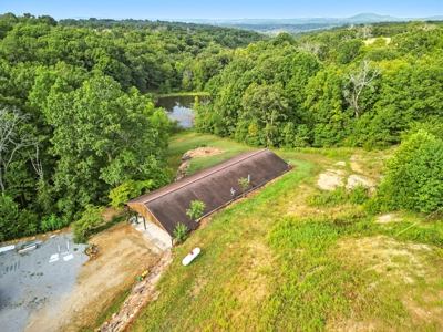 Earth-Berm Log Home on 19 Acres with Pond & Springs - image 25