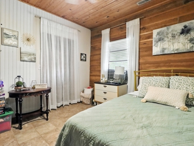Earth-Berm Log Home on 19 Acres with Pond & Springs - image 13