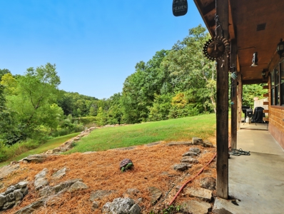 Earth-Berm Log Home on 19 Acres with Pond & Springs - image 23