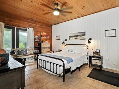 Earth-Berm Log Home on 19 Acres with Pond & Springs - image 9