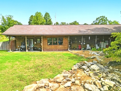 Earth-Berm Log Home on 19 Acres with Pond & Springs - image 1