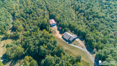 Country home & 64 acres, shop, barn, custom home & guest house - image 45