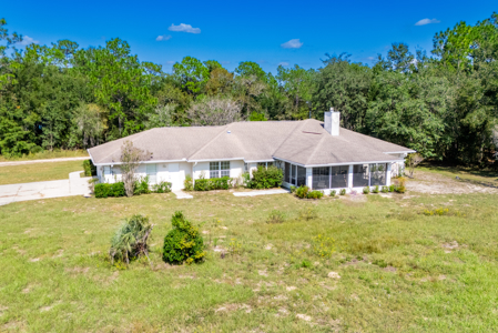 Home with a backyard golf course view - image 35