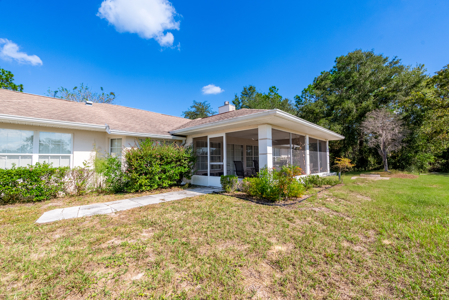 Home with a backyard golf course view - image 42