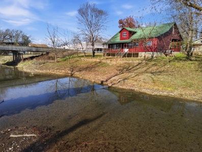 Welcome to a place with comfort, charm, and riverfront living - image 3