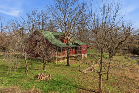 Welcome to a place with comfort, charm, and riverfront living - image 32