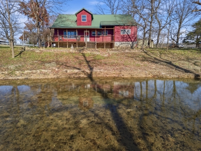 Welcome to a place with comfort, charm, and riverfront living - image 1