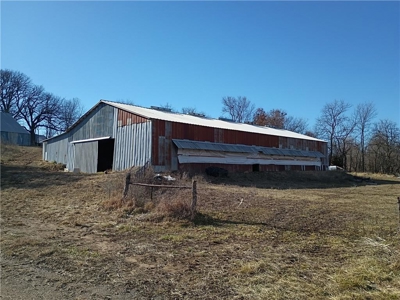 25.5+/- North of Stanberry with Pond, Shop & Scenic Build Sites - image 4