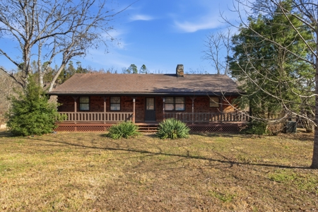 Riverfront Log Home on 5 Acres with Income Potential - image 1