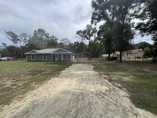 1 Acre. 3 Bedrooms. Paved Road. Perfect Location.