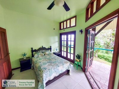 Titled Waterfront Home with Elevated Sea Views and Breezes - image 22