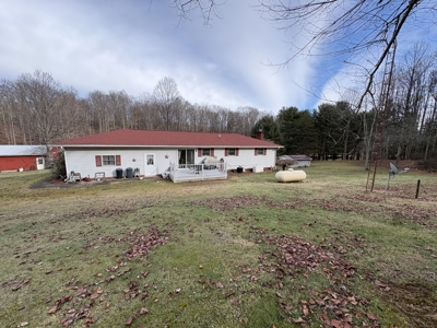 Beallsville OH Ranch home on 26 +/- Acres with buildings and pond - image 1