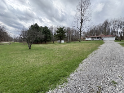 Beallsville OH Ranch home on 26 +/- Acres with buildings and pond - image 3