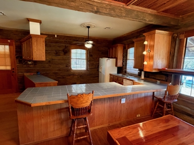 A Rare Riverfront Log Cabin Retreat in Butte La Rose - image 17